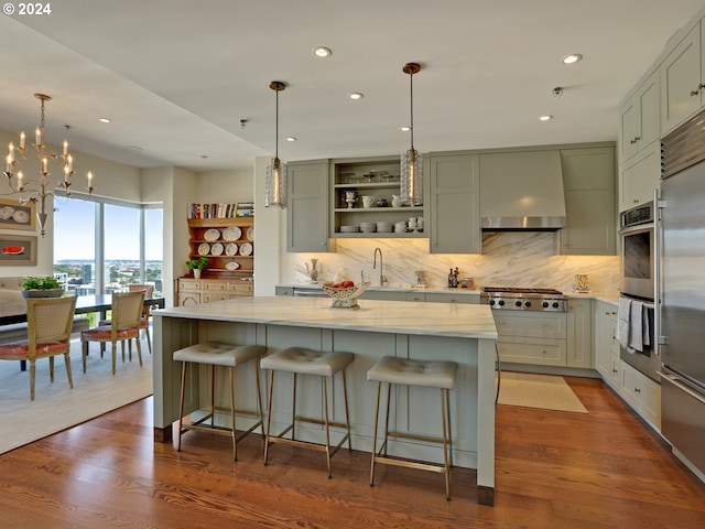 kitchen featuring dark wood-type flooring, stainless steel appliances, open shelves, a sink, and exhaust hood