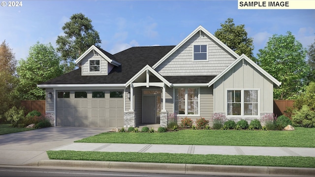 view of front facade with a garage and a front lawn