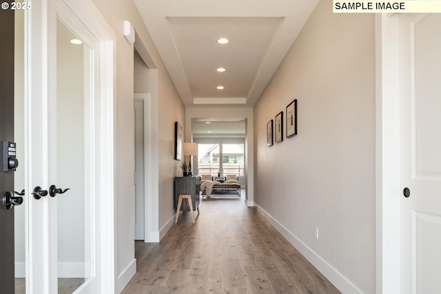 hall with light hardwood / wood-style flooring