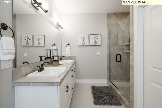 bathroom with tile patterned flooring, vanity, and an enclosed shower