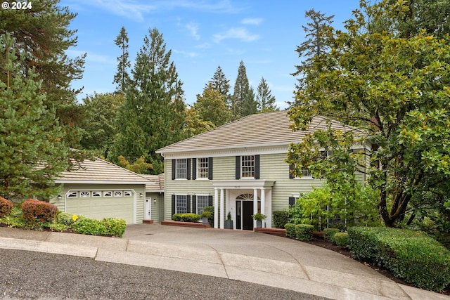 colonial home with a garage