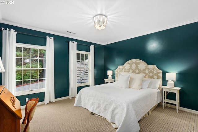 carpeted bedroom featuring ornamental molding