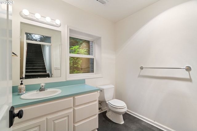 bathroom with vanity and toilet