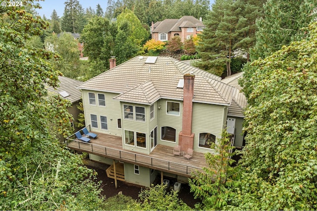 rear view of house with a wooden deck