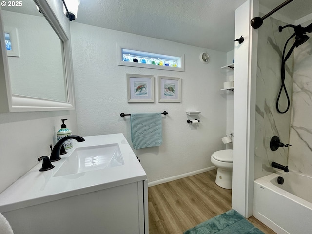 full bath with a textured ceiling, vanity, toilet, and wood finished floors