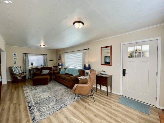 665 Clearlake Ave, Winchester Bay, OR 97467 - living room with light wood-style flooring, ornamental molding, and baseboards