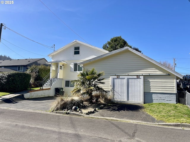 view of front of property featuring fence