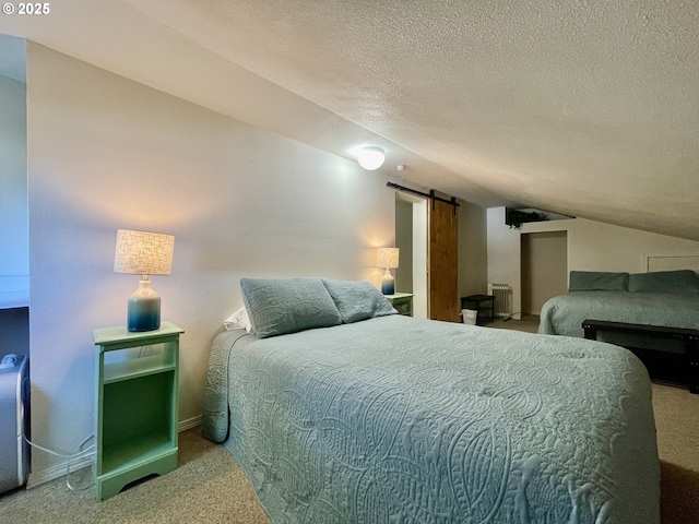 bedroom featuring radiator, a barn door, carpet flooring, vaulted ceiling, and a textured ceiling