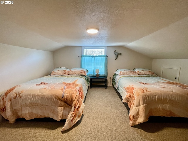 carpeted bedroom featuring lofted ceiling and a textured ceiling