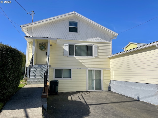 665 Clearlake Ave, Winchester Bay, OR 97467 - back of house featuring entry steps and a patio