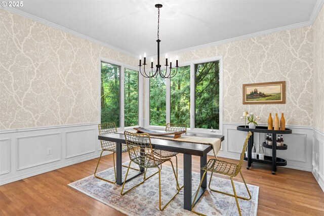 1739 Palisades Terrace Dr, Lake Oswego, OR 97034 - dining area with wallpapered walls, crown molding, a chandelier, a wainscoted wall, and wood finished floors