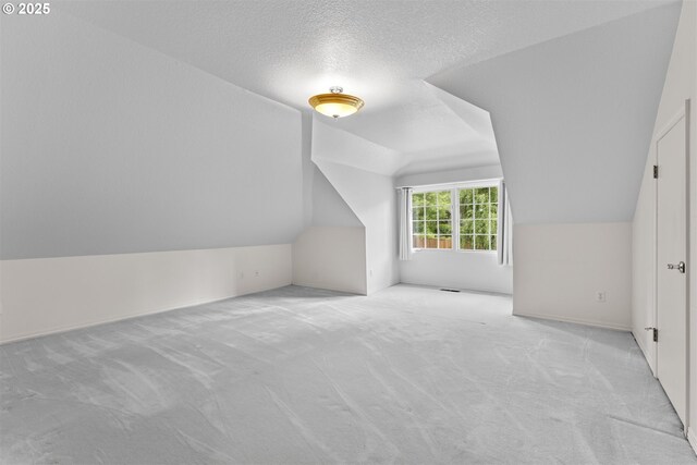 1739 Palisades Terrace Dr, Lake Oswego, OR 97034 - bonus room featuring lofted ceiling, carpet flooring, and a textured ceiling