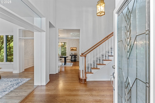 1739 Palisades Terrace Dr, Lake Oswego, OR 97034 - entrance foyer featuring wood finished floors, a towering ceiling, stairs, and baseboards