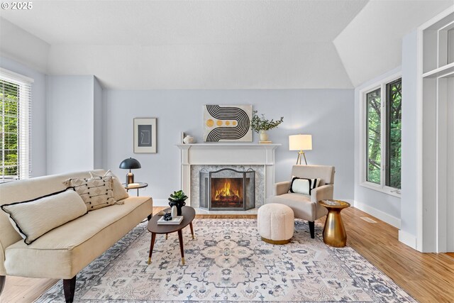 1739 Palisades Terrace Dr, Lake Oswego, OR 97034 - living room with wood finished floors, a high end fireplace, baseboards, and vaulted ceiling