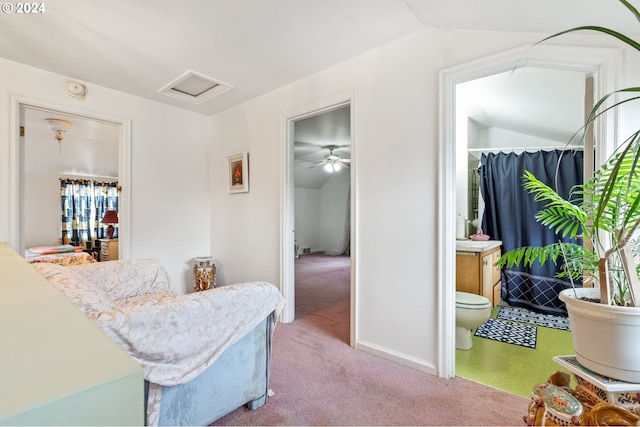 hall featuring light colored carpet and lofted ceiling