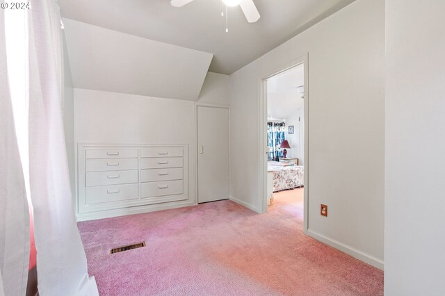 additional living space with light carpet and ceiling fan