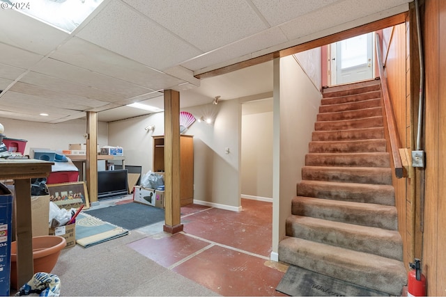 basement featuring a drop ceiling