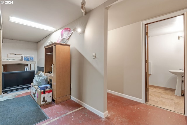 interior space with concrete floors and sink