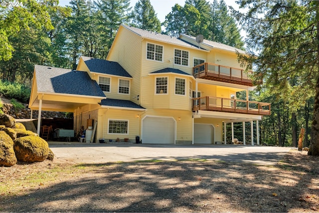 view of front of house featuring a balcony and a garage