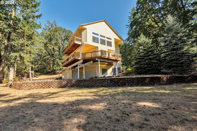 back of house with a wooden deck