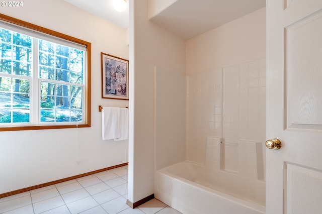 bathroom with tile patterned flooring and shower / tub combination