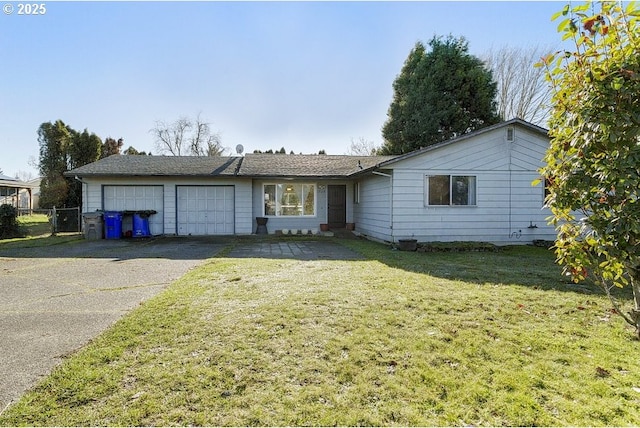 ranch-style home with a front yard and a garage