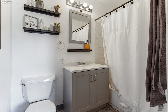 full bathroom with shower / bath combo, vanity, and toilet