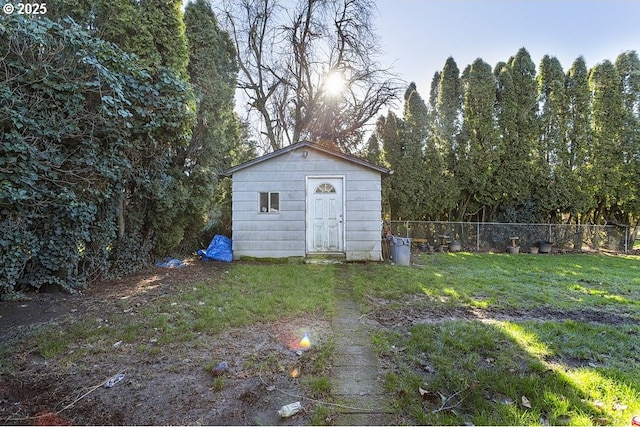 view of outbuilding with a lawn