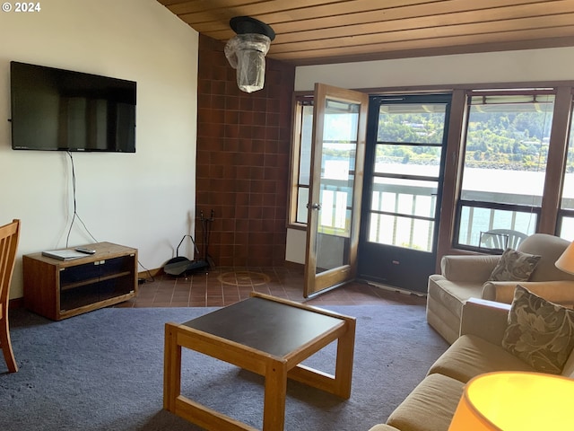 carpeted living area featuring wooden ceiling and tile patterned flooring