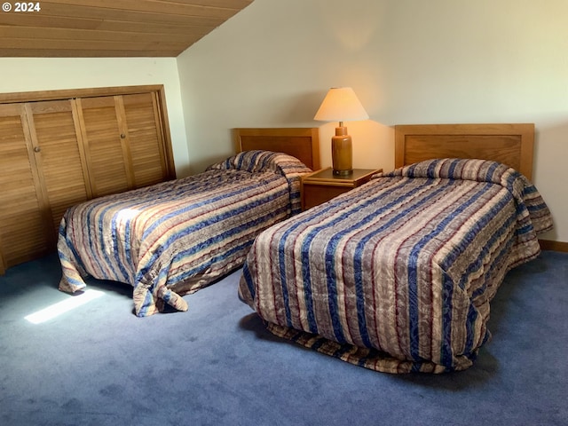 bedroom featuring lofted ceiling, carpet, and wood ceiling