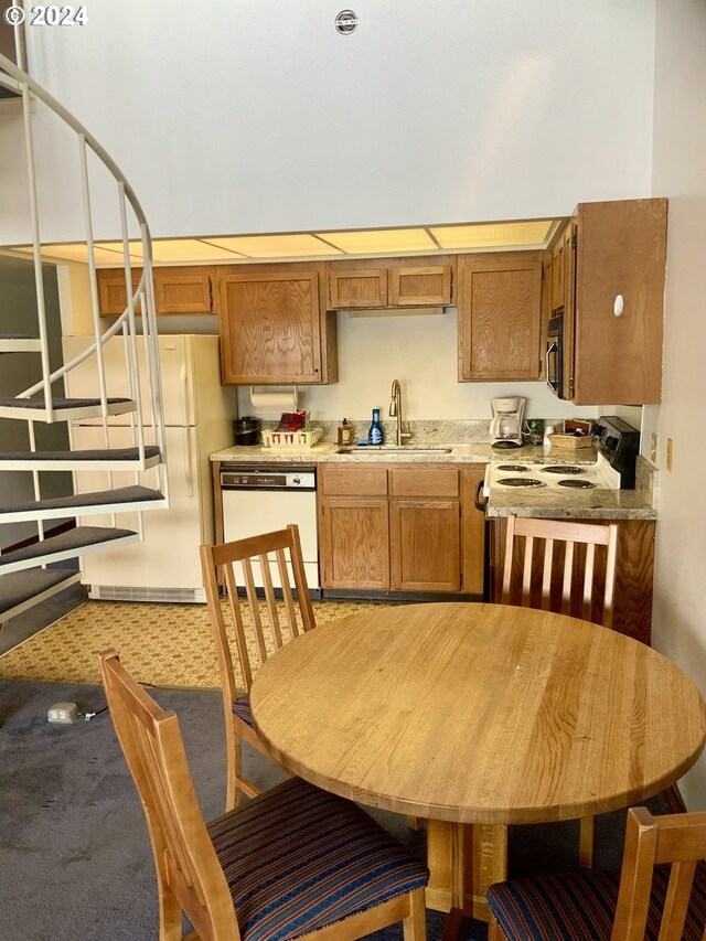 kitchen with white appliances and sink