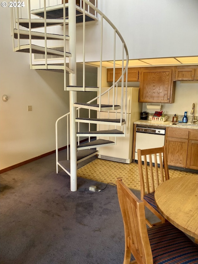 stairs featuring carpet and baseboards