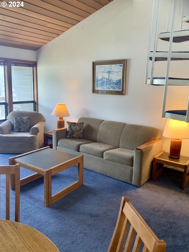 carpeted living area with vaulted ceiling and wood ceiling