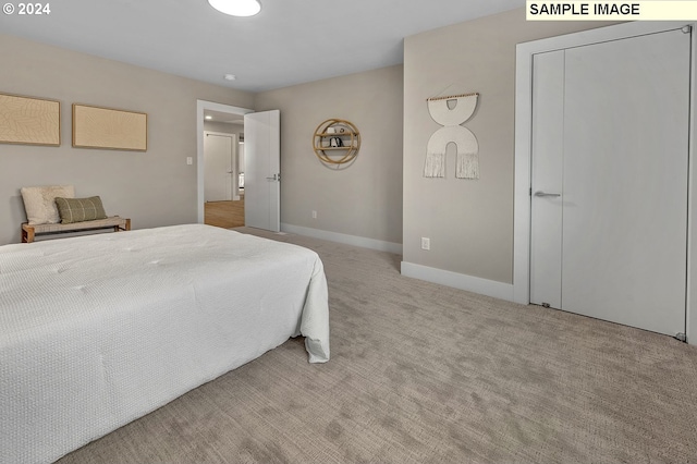 bedroom with light colored carpet