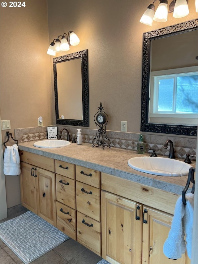 bathroom featuring tile patterned flooring and vanity