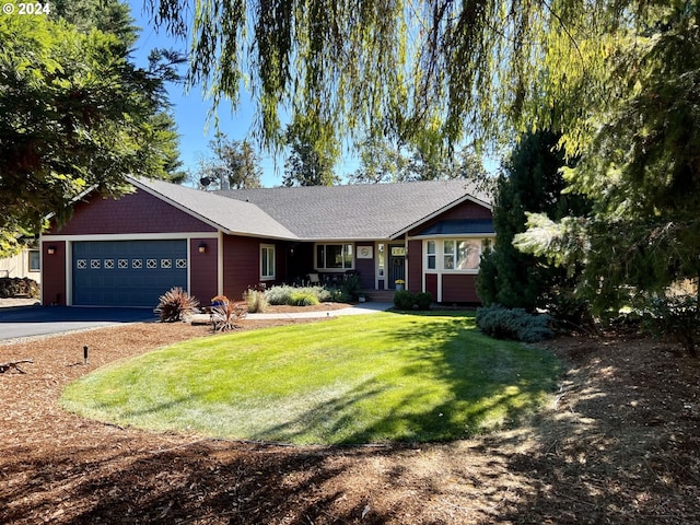 single story home featuring a front yard and a garage