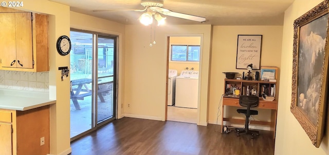 interior space featuring dark hardwood / wood-style flooring, washer and clothes dryer, and ceiling fan