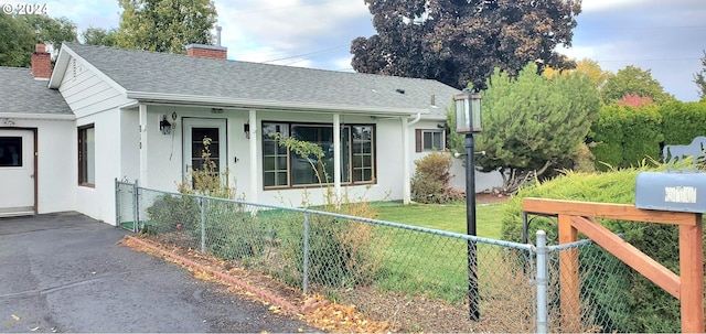 view of side of property with a yard