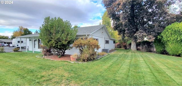 view of yard with central AC unit