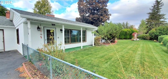 exterior space with a lawn