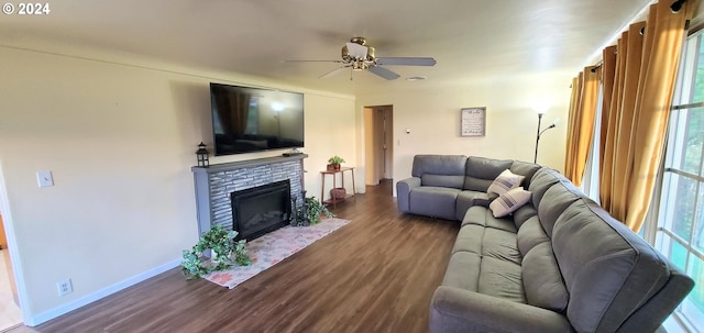 living room with ceiling fan and dark hardwood / wood-style flooring