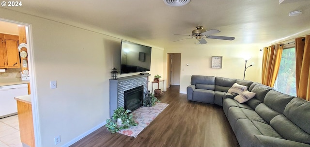 living room featuring ceiling fan and light wood-type flooring