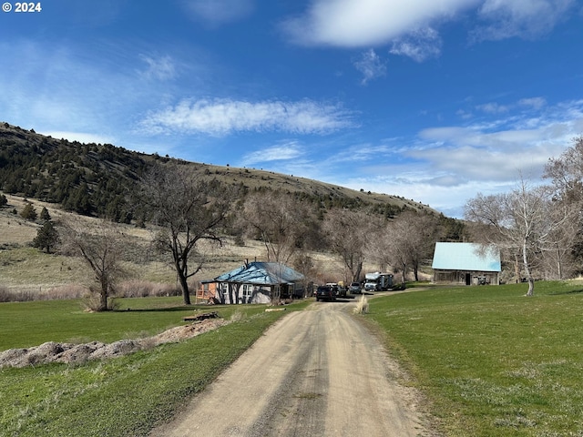 view of road with a mountain view and a rural view