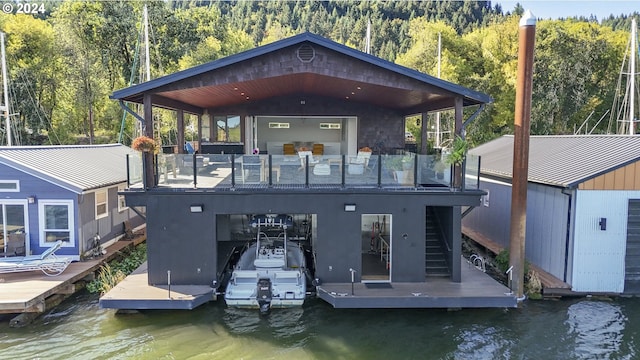 back of house with a water view