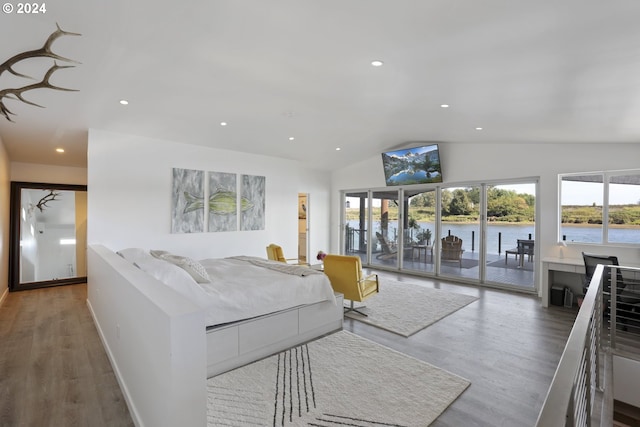 living room with hardwood / wood-style flooring and lofted ceiling