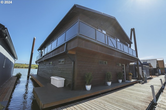 exterior space featuring a water view and a balcony