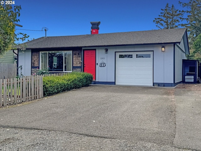 ranch-style home with a garage