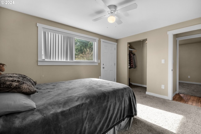 bedroom with ceiling fan, a closet, and hardwood / wood-style floors