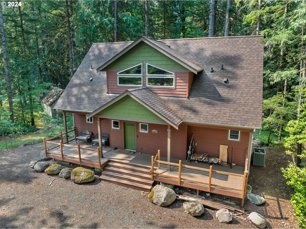 view of front of house featuring central air condition unit and a deck