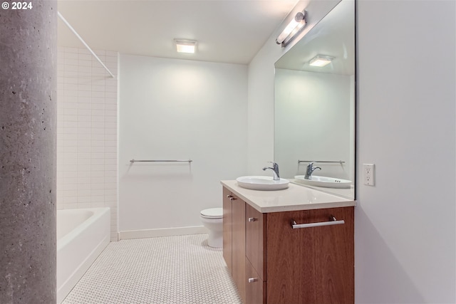 full bathroom with tile patterned flooring,  shower combination, vanity, and toilet